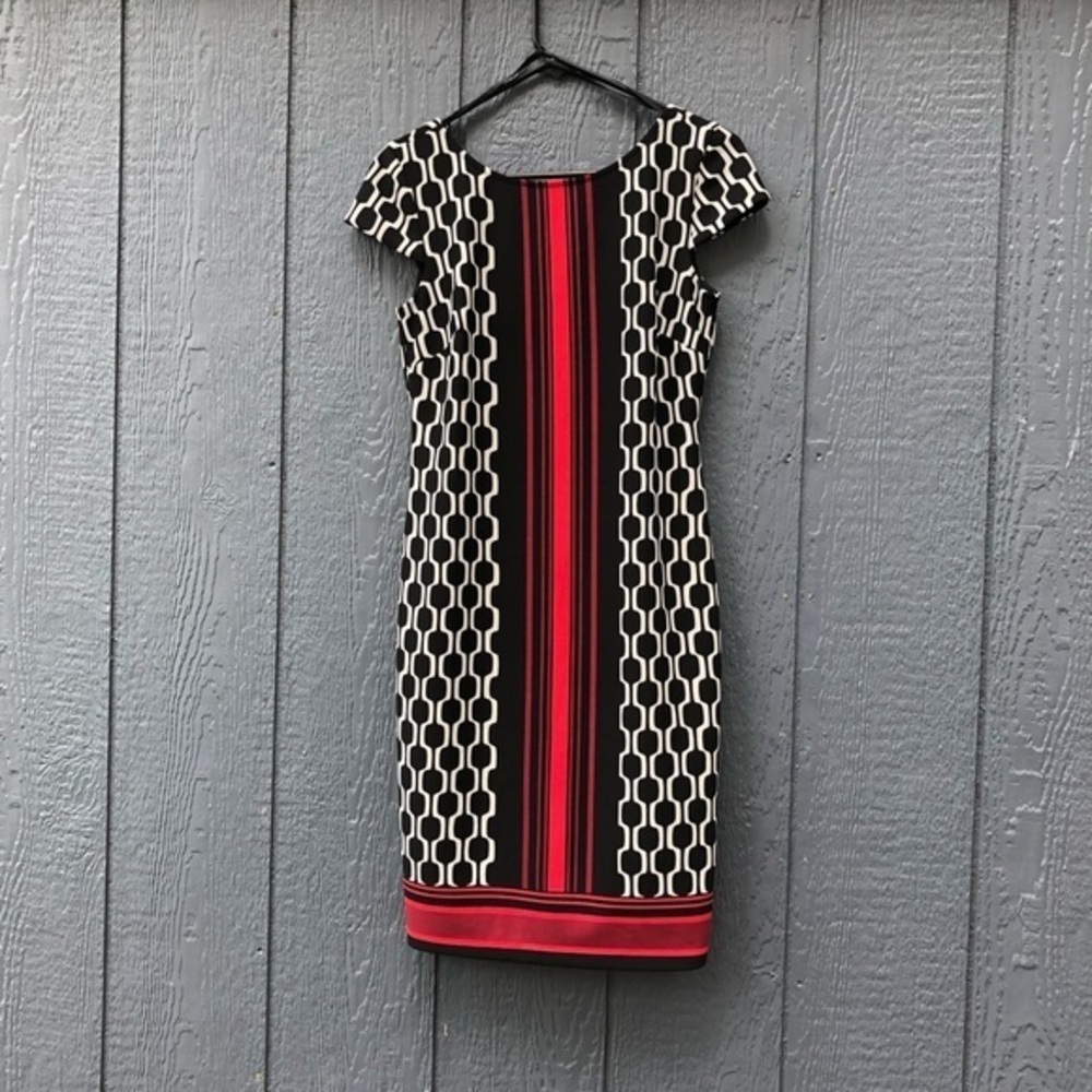 db established 1962 Black white and red dress with cap sleeves.
